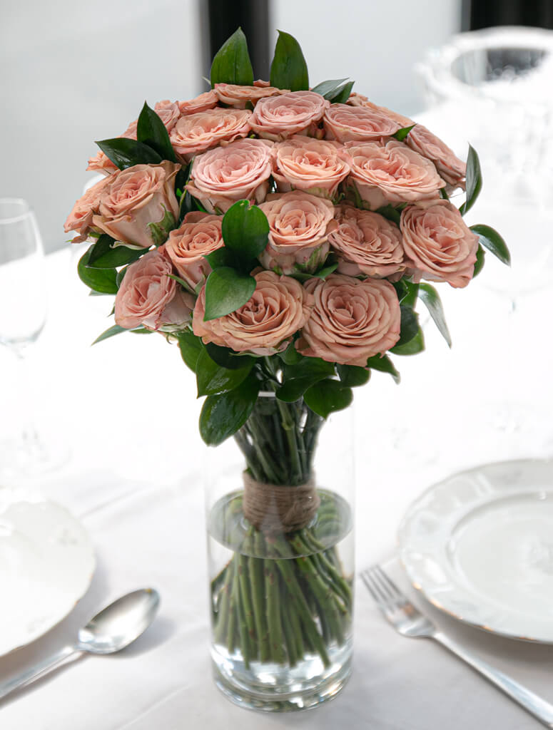 Single vase of dusty pink roses