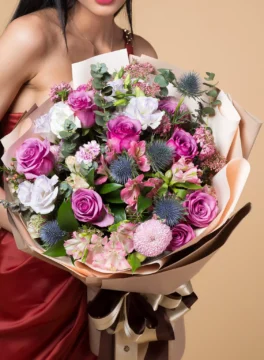Bouquet of purple roses and purple altosmeria