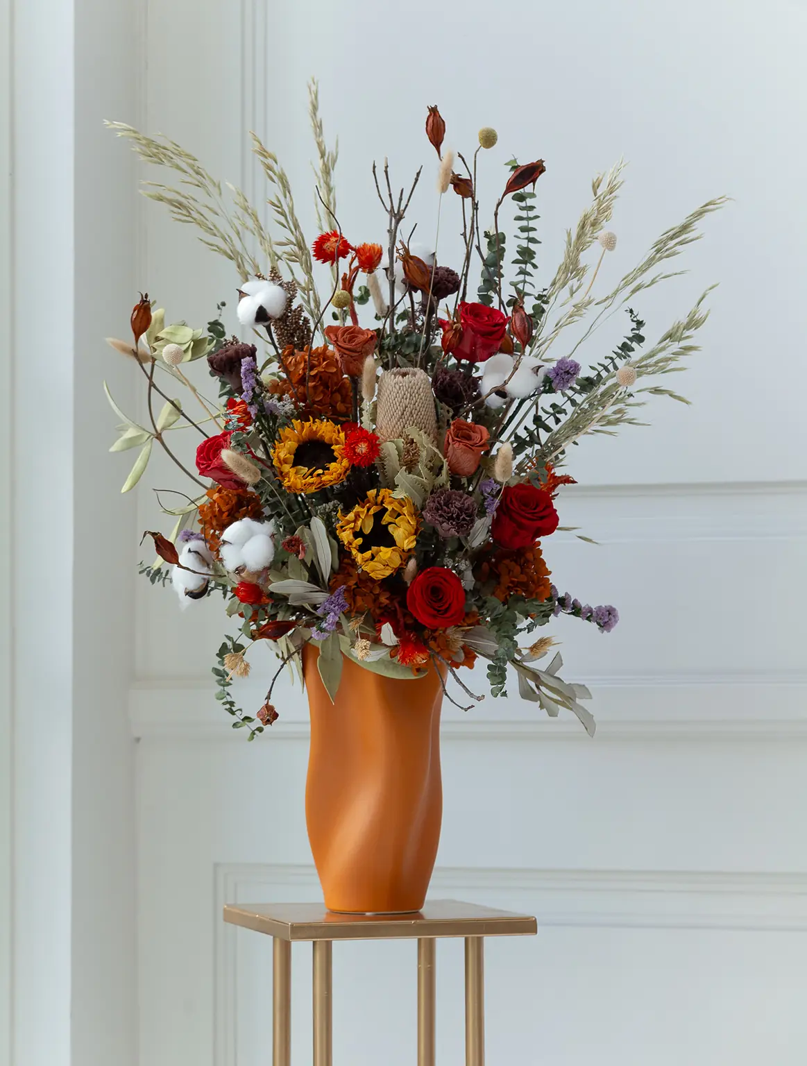 Queen Bee dried flower in vase with sunflowers, red roses, and cotton flowers