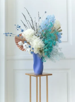 premium dried flowers in vase with white hydrengea