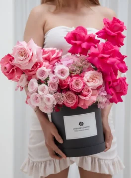 Flower box arrangement of roses, hydrangea, spray roses front view
