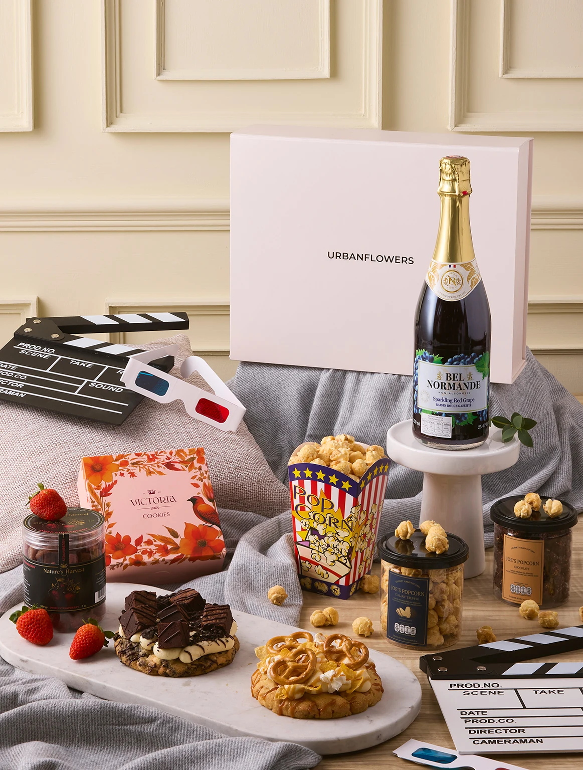 Movie Night Hamper with cookies, popcorn, marshmallow jar, and sparkling grape drink by UrbanFlowers.