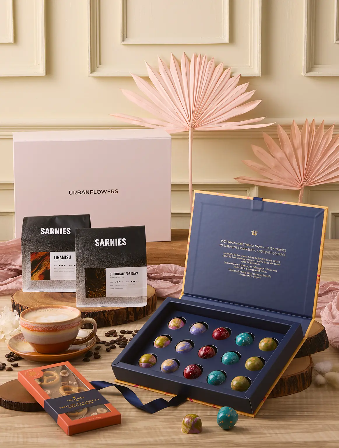 The Coffee Lover Hamper with Sarnies coffee beans, Belgian pralines, and chocolate bar by UrbanFlowers.