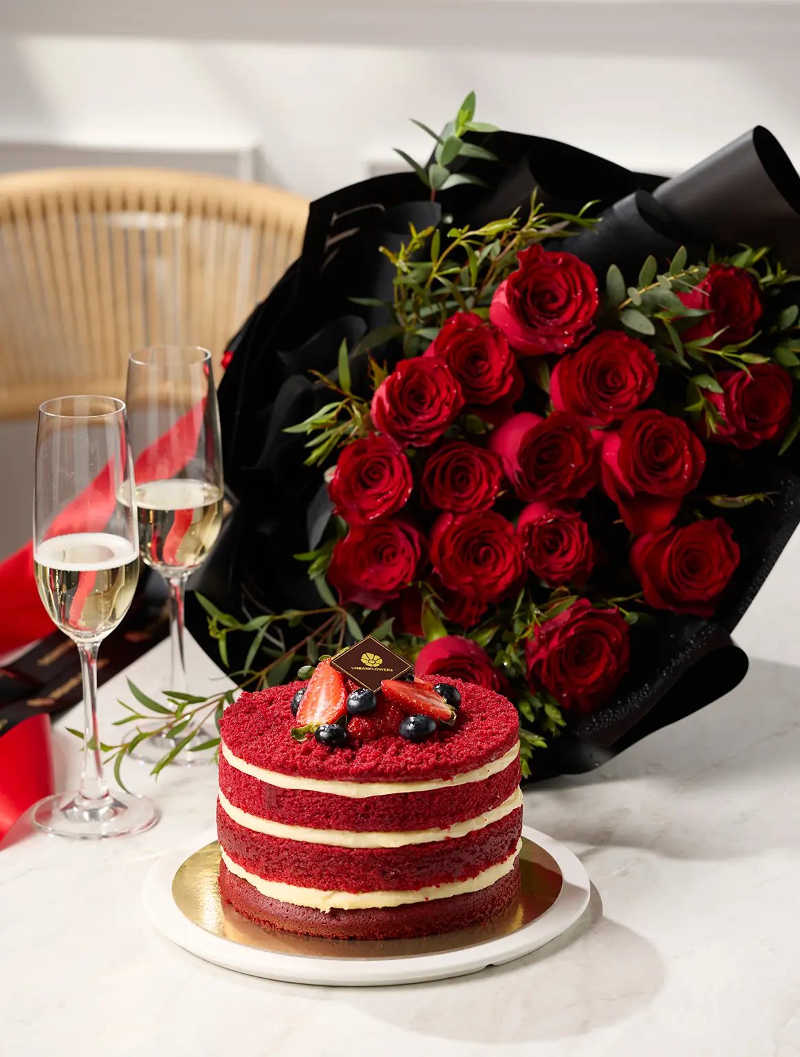 Red bouquet, black paper flowers and red velvet cake