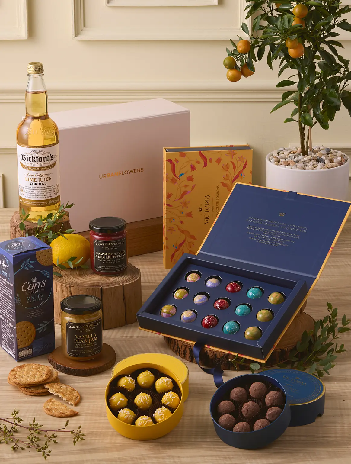 The Sweet Celebration Hamper with Belgian chocolates, truffles, jams, and lime cordial by UrbanFlowers