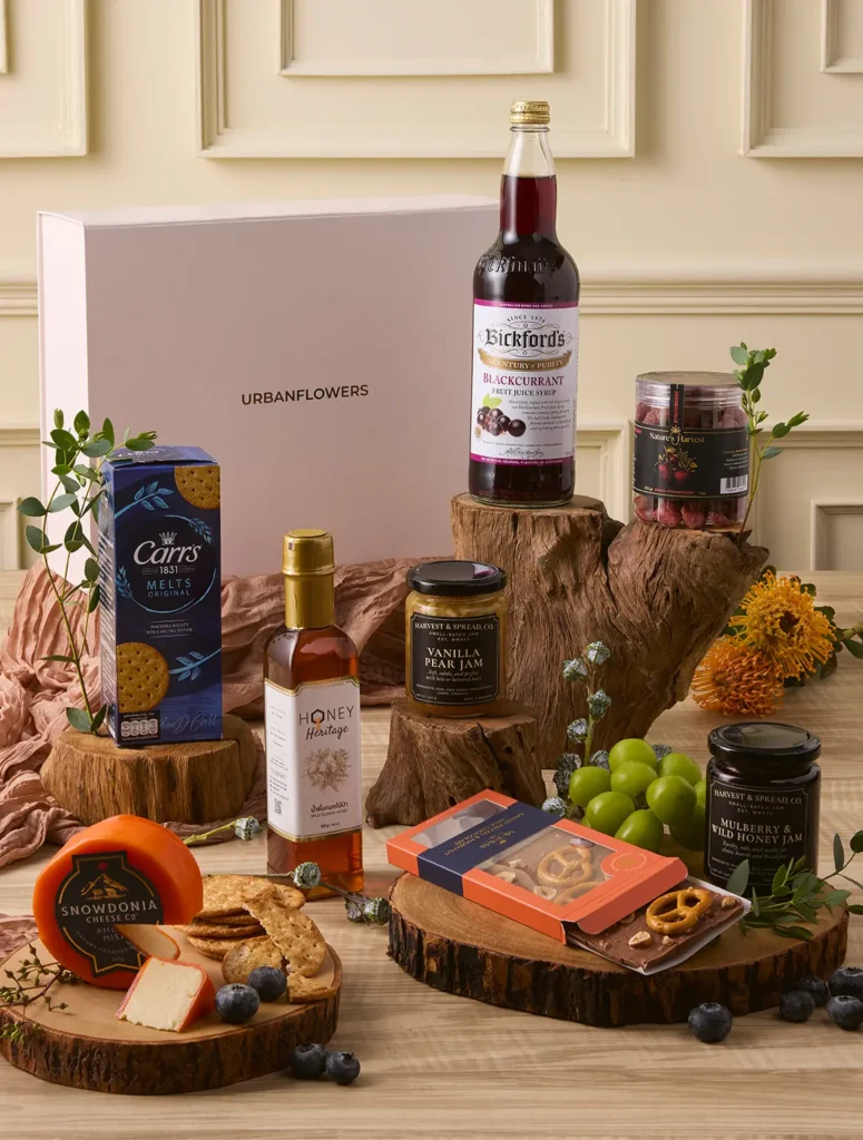 Cheese Night Delight Hamper with cheddar, blackcurrant cordial, jams, honey, and Belgian chocolate by UrbanFlowers