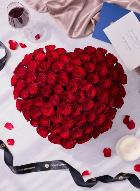 100 premium red roses with a black heart-shaped flower box