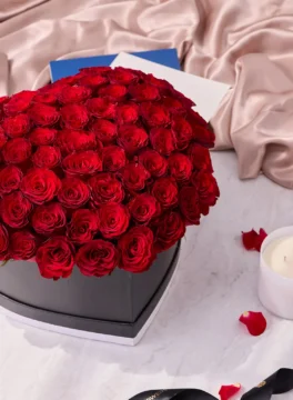100 red roses with a black heart-shaped flower box