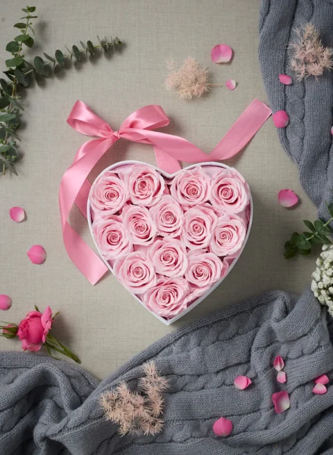 Pink preserved roses in a heart-shaped box