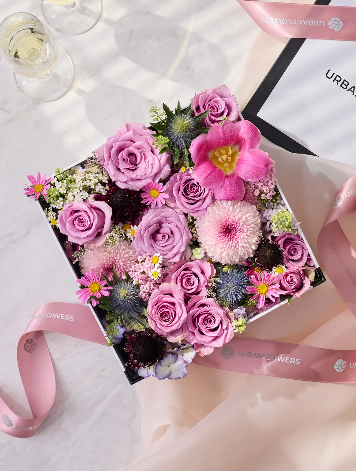 Fresh flower box, purple roses, pink tulips
