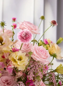 Flowers in a champagne bucket, pastel pink flowers