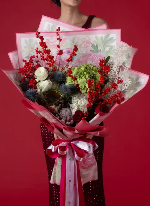 Red and green Christmas fresh flower bouquet