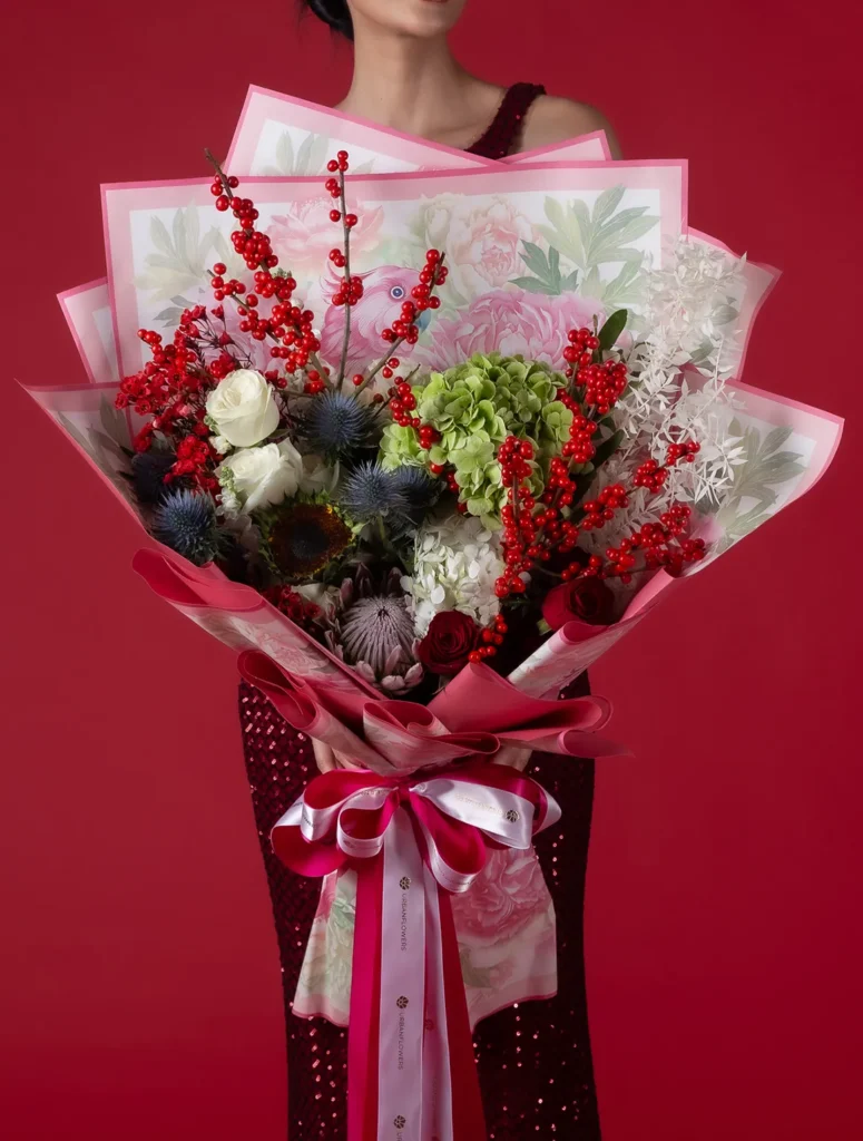 Red and green Christmas fresh flower bouquet