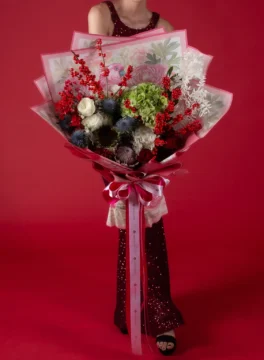 Beautiful red and green fresh flower bouquet for Christmas