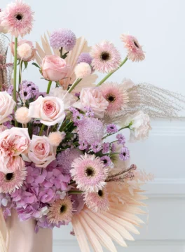 Vase of fresh flowers, light pink roses