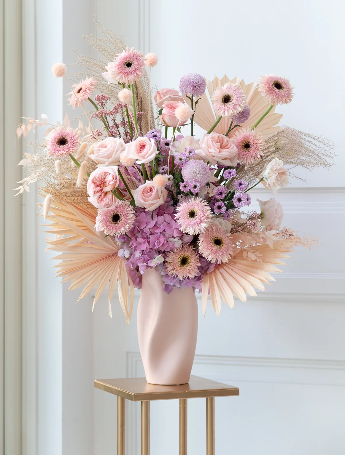 Vase of light pink fresh flowers pink gerbera flower