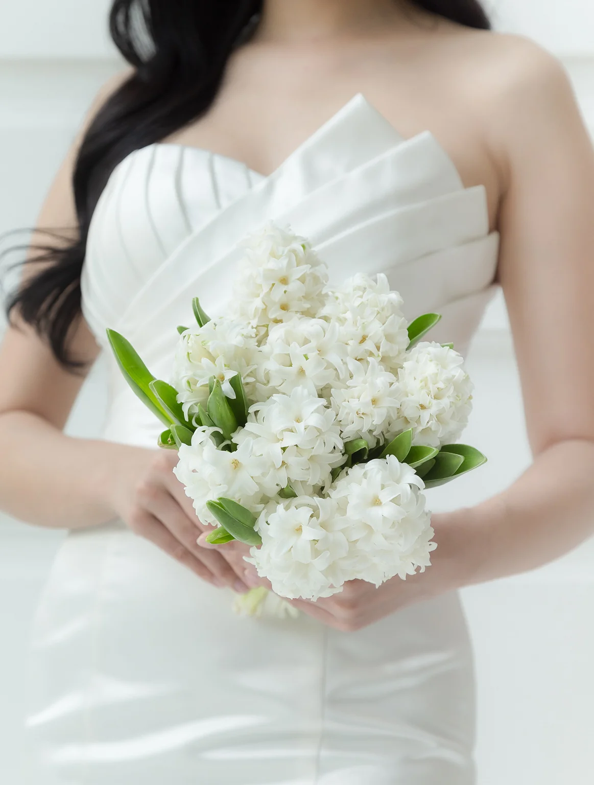 All white wedding bouquet with hyacinths