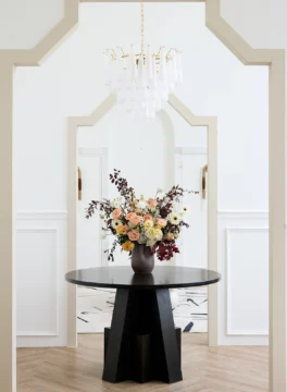 White mum flowers in a vase rose colored cappuccino