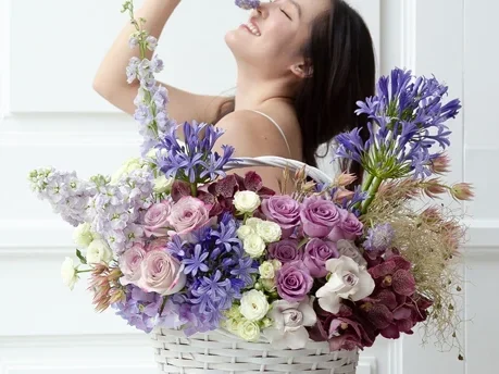 Elegant purple and white flower basket with hydrangeas and roses