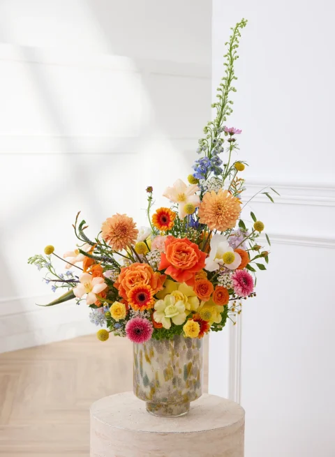 Fresh flower in vase, orange rose basket