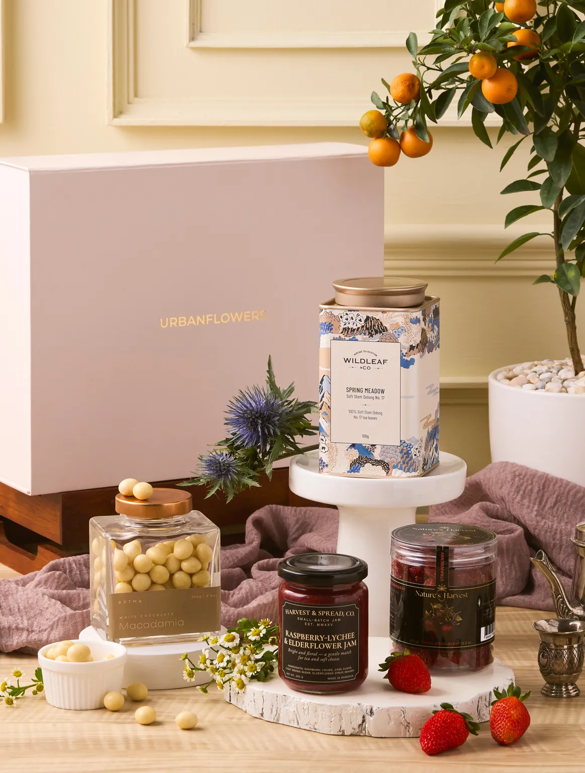 Spring Meadow Hamper with oolong tea, artisan jam, white chocolate macadamias, and dried strawberries by UrbanFlowers.