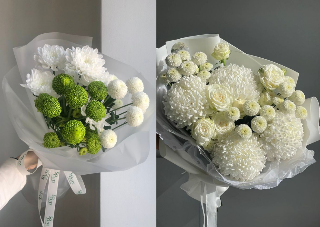 Green and white pom-pom flowers arranged in a bouquet.