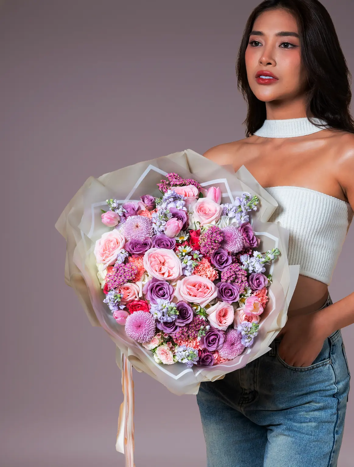 Bouquet of tulips and purple roses wrapped bouquet