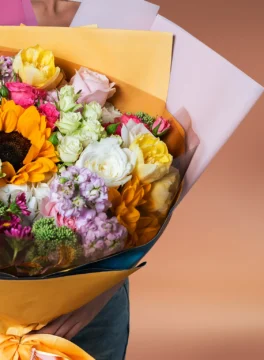 Beautiful bouquet of sunflowers and white roses and yellow tulips