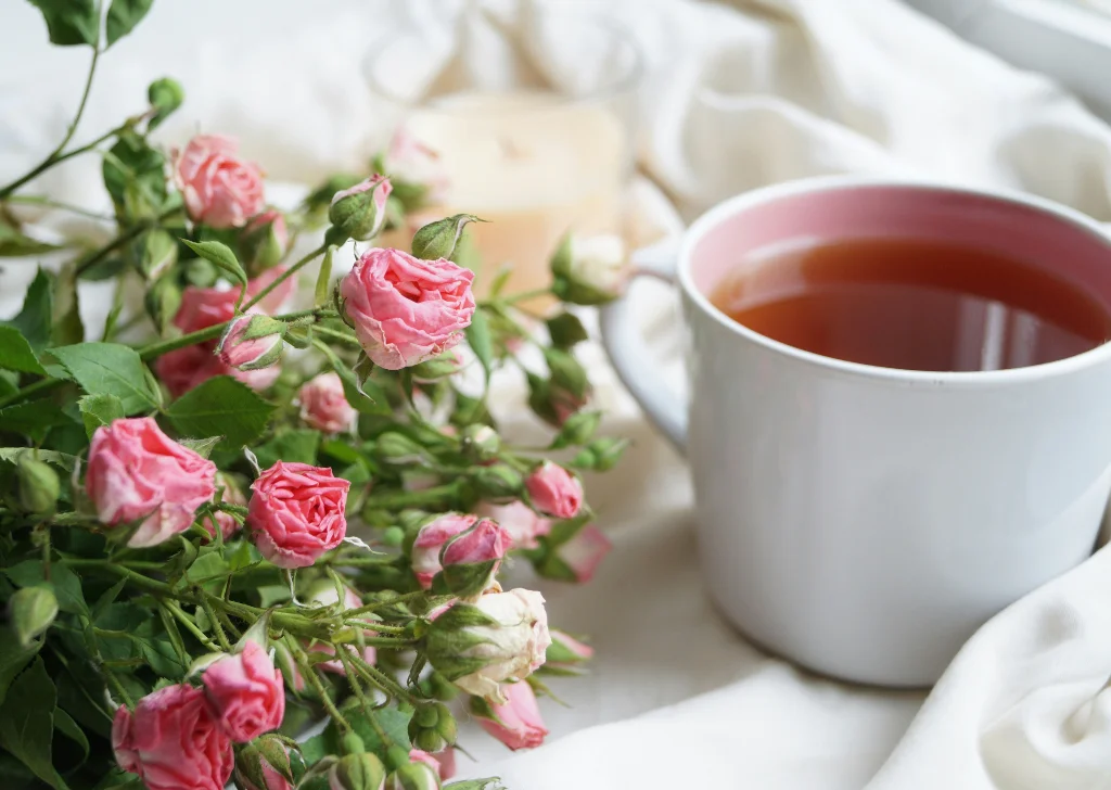 Tea roses paired with hot tea.
