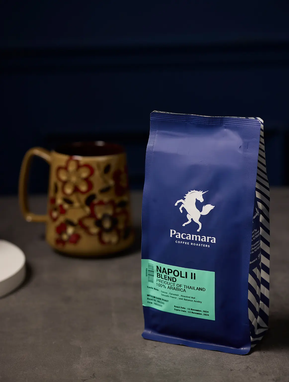 Vintage leather notebook and Pacamara coffee beside ceramic mug