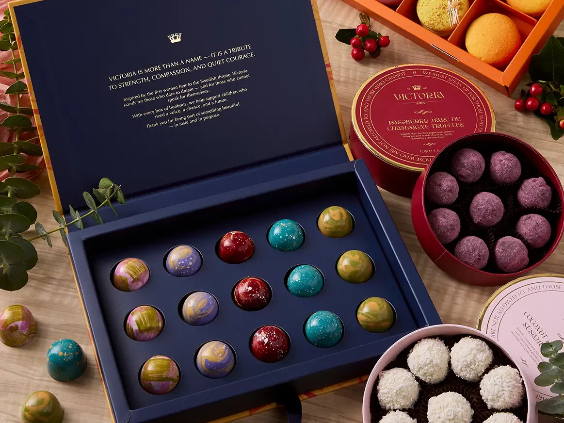 Chocolate & Bubbles Hamper with Belgian pralines, truffles, macarons, and sparkling red grape juice by UrbanFlowers.