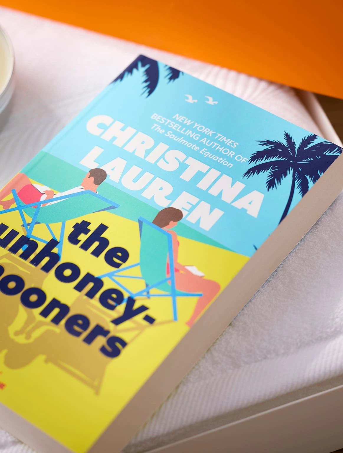 the-unhoneymooners-book-white-towel-orange-gift-box-close-up